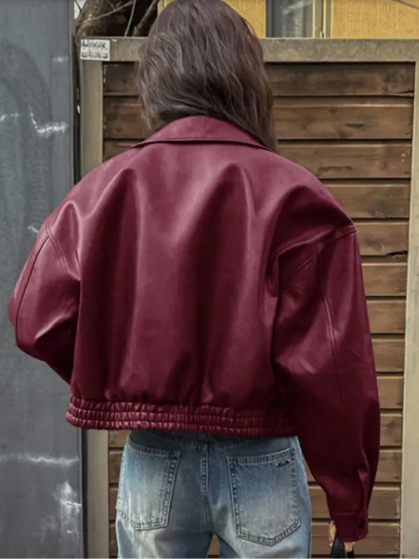 Cropped zip-up fashion jacket for women, featuring a crisp stand collar and contemporary design.