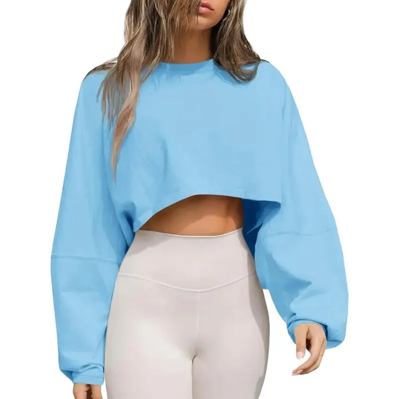 Cropped oversized women's sweatshirt with a crew neck, long sleeves, and relaxed fit for athleisure.