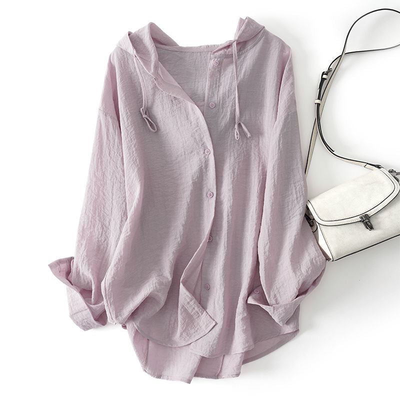 Comfortable women's drawstring hoodie top with relaxed fit. A chic pullover for everyday casual elegance in spring.