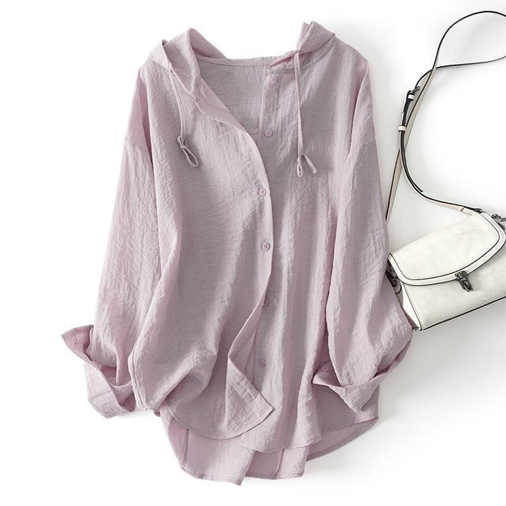 Comfortable women's drawstring hoodie top with relaxed fit. A chic pullover for everyday casual elegance in spring.