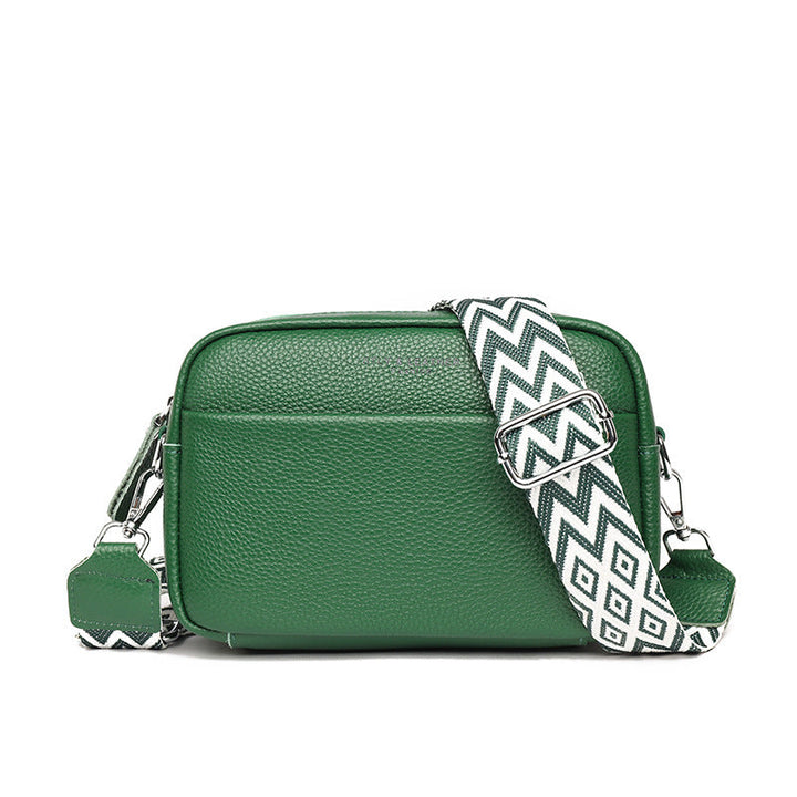 Woman enjoying a cafe moment with her modern crossbody bag, a stylish everyday and travel companion.