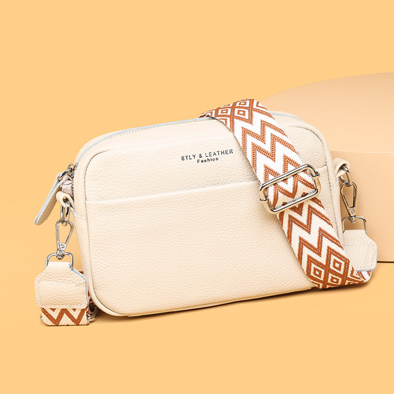 Back view of a women's versatile travel crossbody bag, showing sleek design and an accessible pocket.