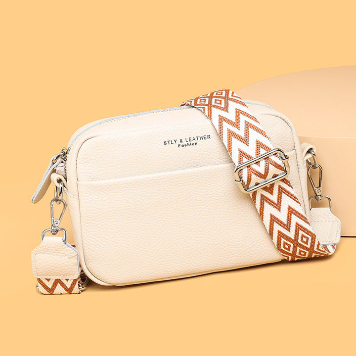 Back view of a women's versatile travel crossbody bag, showing sleek design and an accessible pocket.
