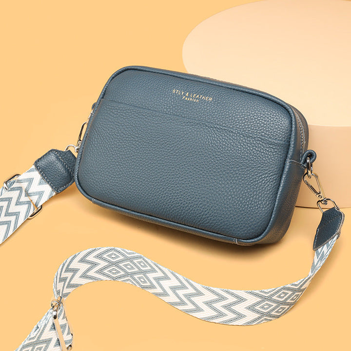 Angled view: a chic everyday shoulder bag, highlighting its structured yet soft and modern silhouette.