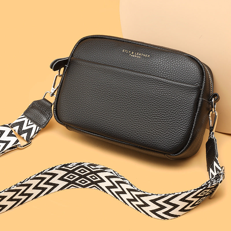 Women's versatile modern crossbody bag in classic black, a timeless and essential fashion accessory.