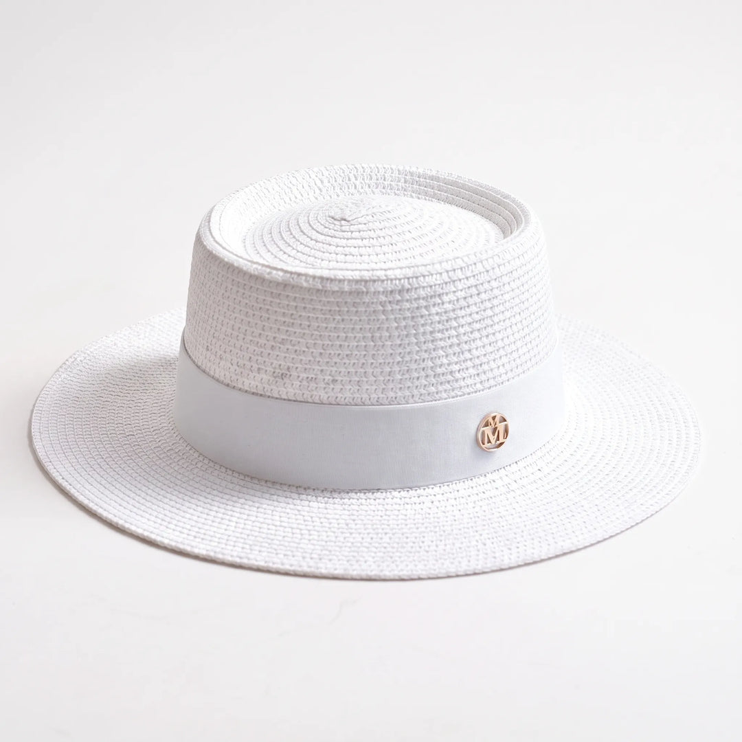 Stylish women's wide brim sun hat with flat top. Ideal for summer, beach, & vacation sun protection.