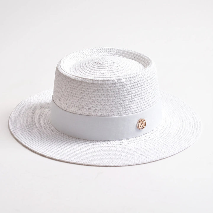 Stylish women's wide brim sun hat with flat top. Ideal for summer, beach, & vacation sun protection.