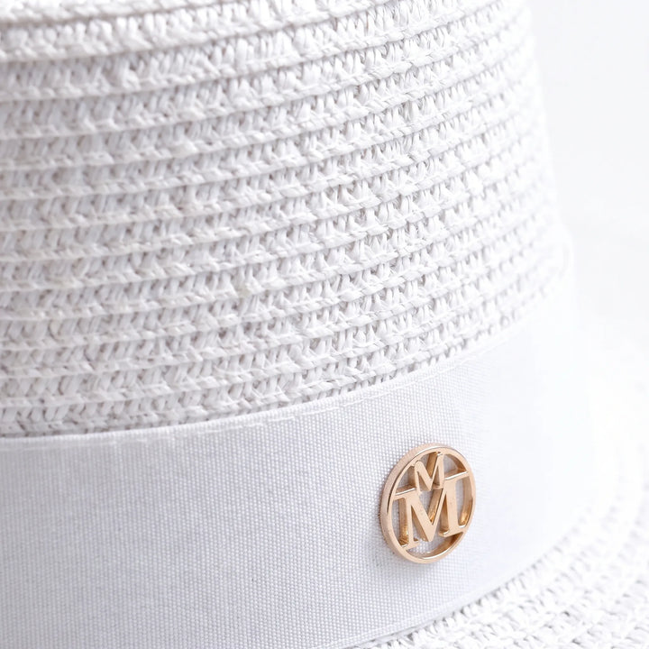 Elegant women's flat top wide brim sun hat. A chic accessory for beach days & summer vacations.