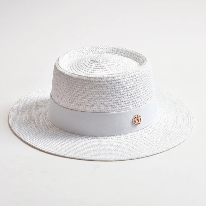 Fashionable women's sun hat. Flat top & wide brim design for summer, beach, & outdoor style.