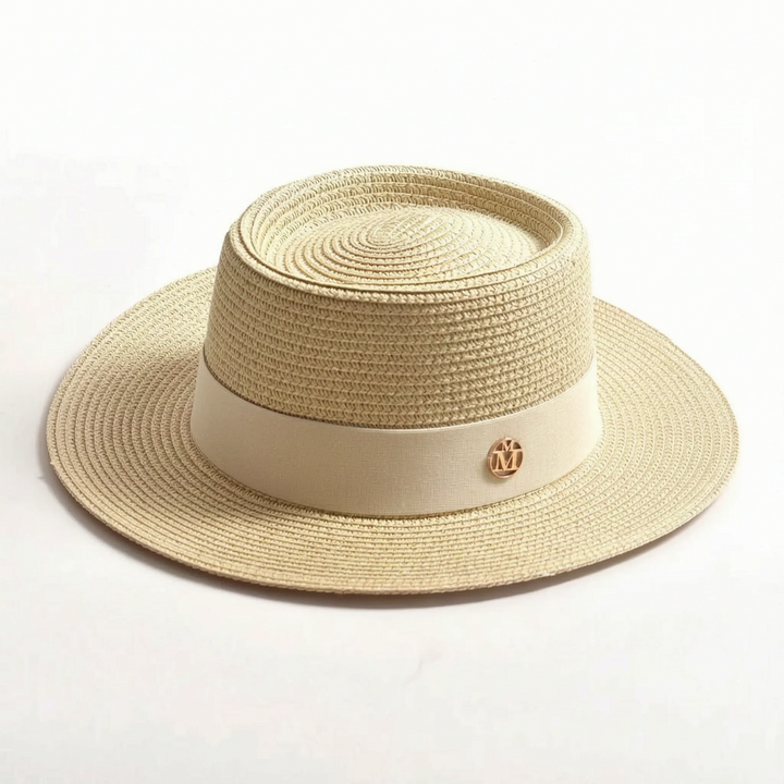 Chic women's wide brim sun hat. Flat top design, perfect for beach, vacation, and summer outdoor wear.