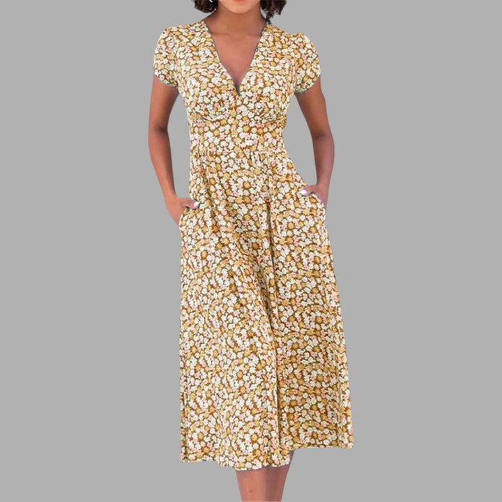 Vibrant floral women's midi dress with a V-neck, short sleeves, and pockets. Ideal for chic spring and summer outfits.