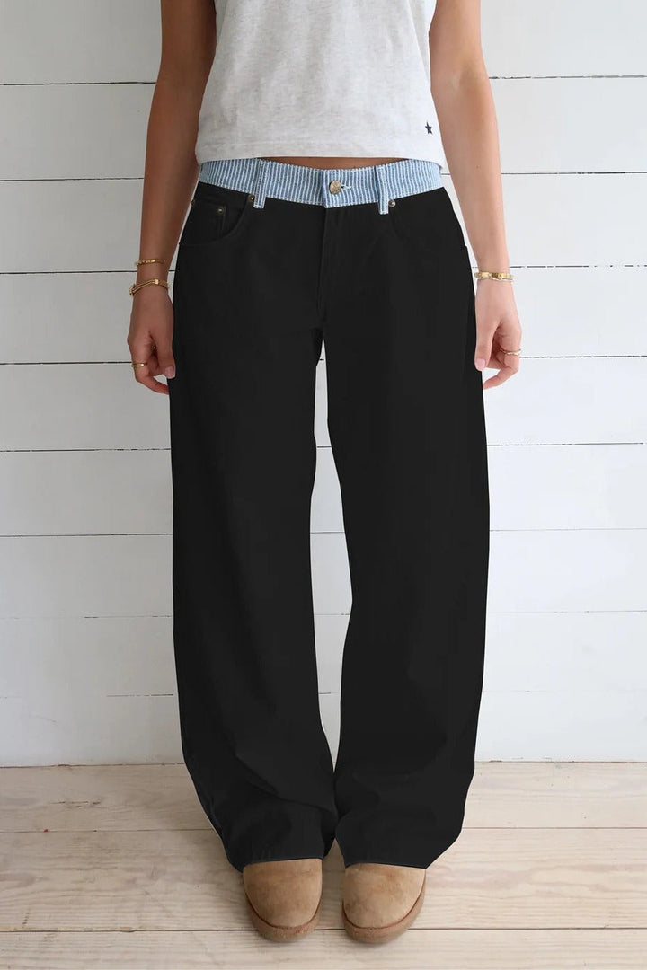 High-rise wide-leg women's jeans paired with a casual top, creating a chic & comfortable outfit.