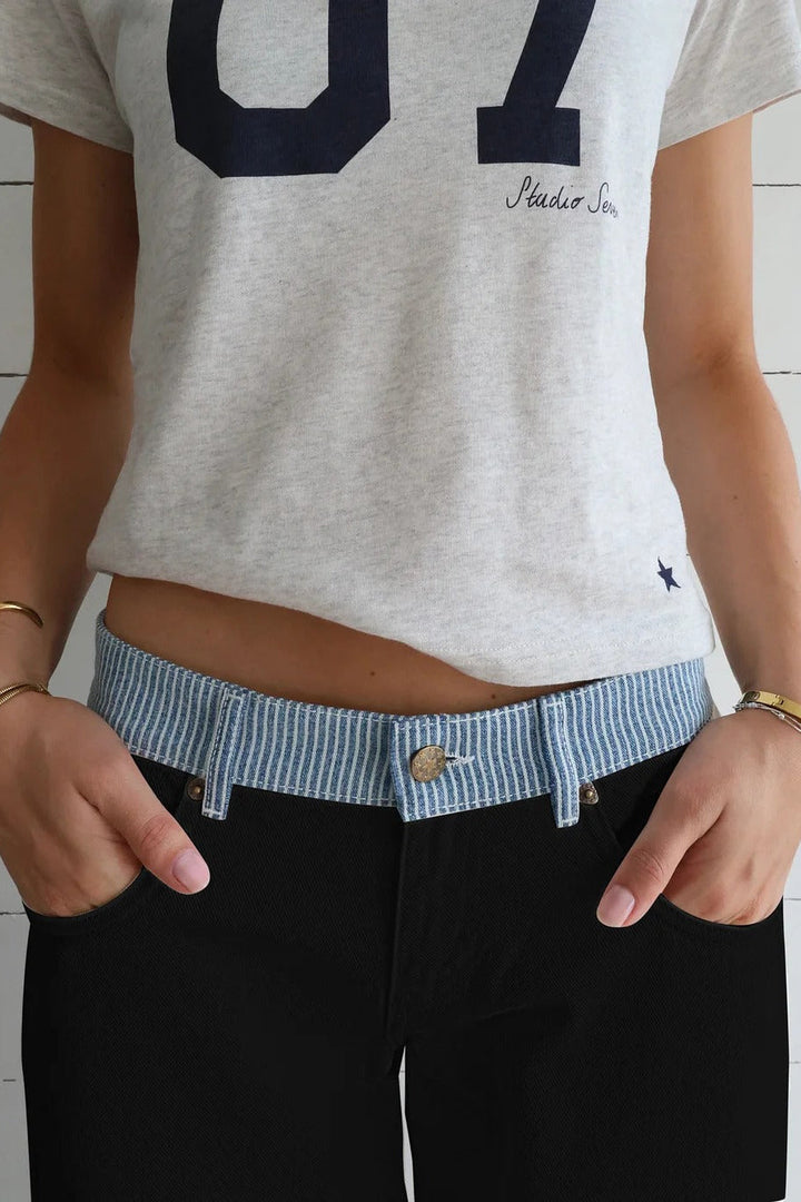 White high-rise wide-leg women's jeans, full length, showing modern, relaxed fit for versatile style.