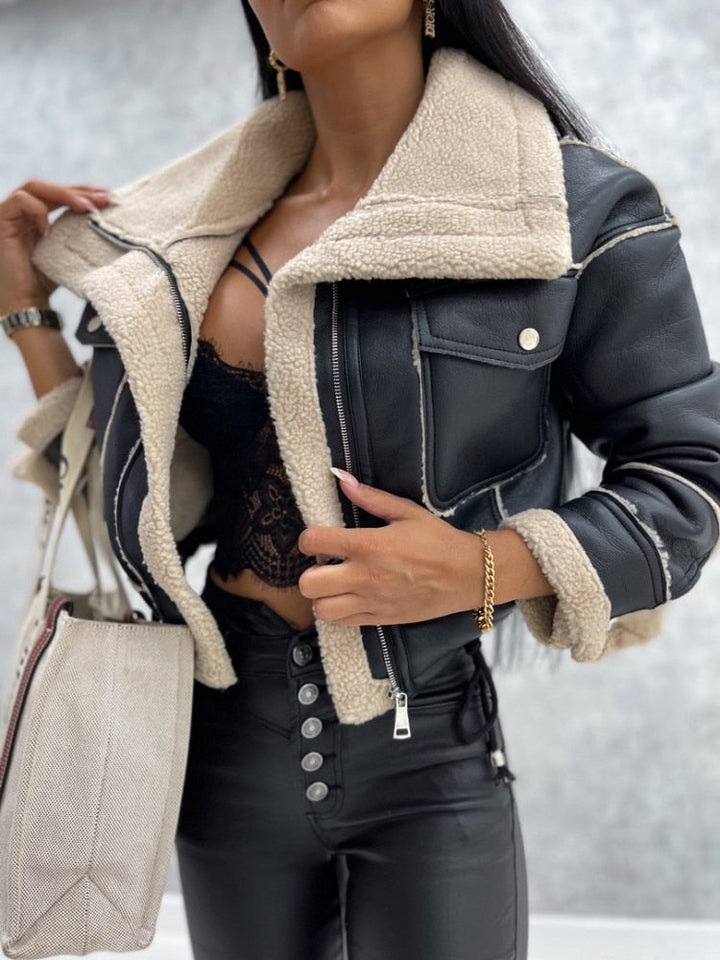 Zoë women's chic lapel motorcycle jacket. Warm sherpa lining, stylish zipper, perfect fall/winter fashion.