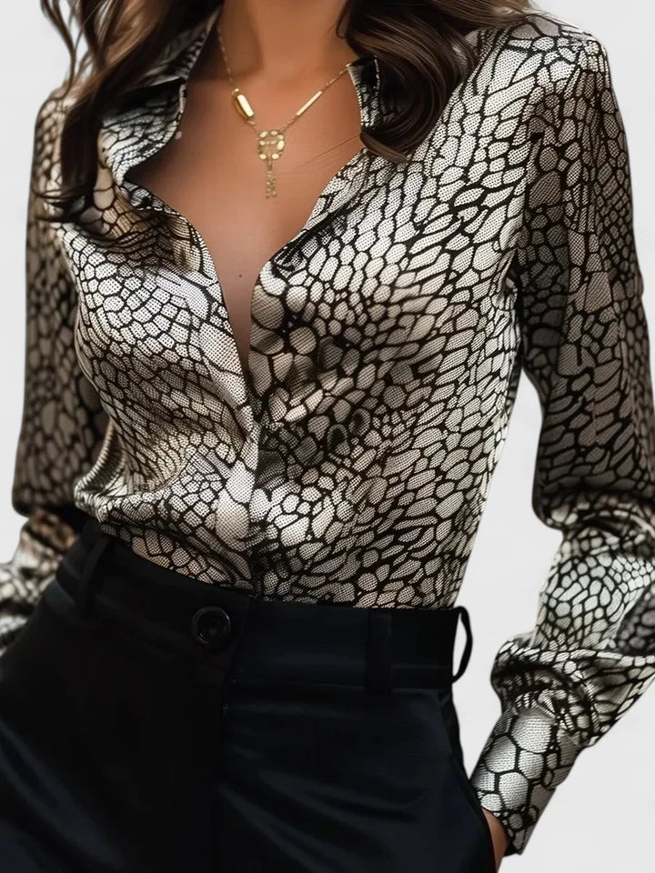 Stylish women's leopard print blouse with collar, ideal for office fashion or a chic statement look.