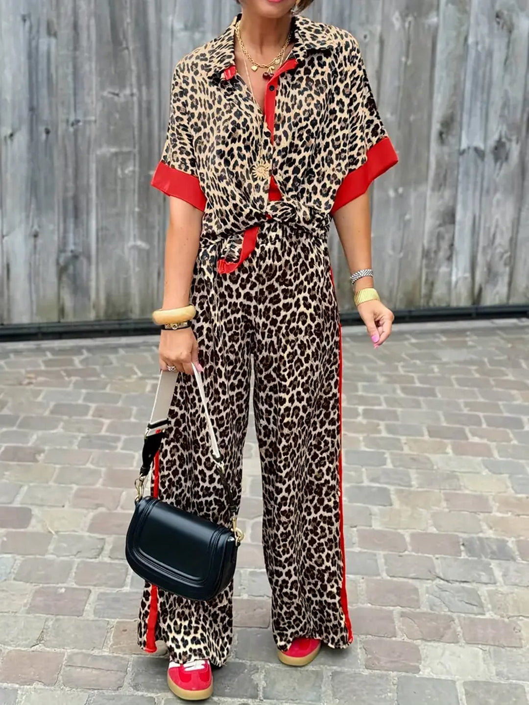 Women's chic leopard print wide leg V-neck jumpsuit. Trendy, comfortable one-piece outfit.