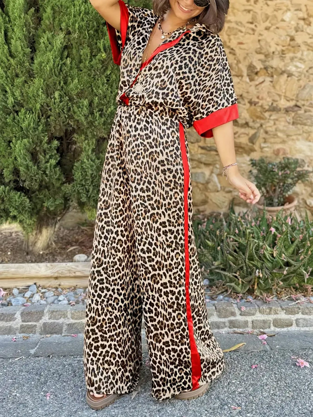 Elegant women's leopard print wide leg V-neck jumpsuit for casual or dressy occasions.
