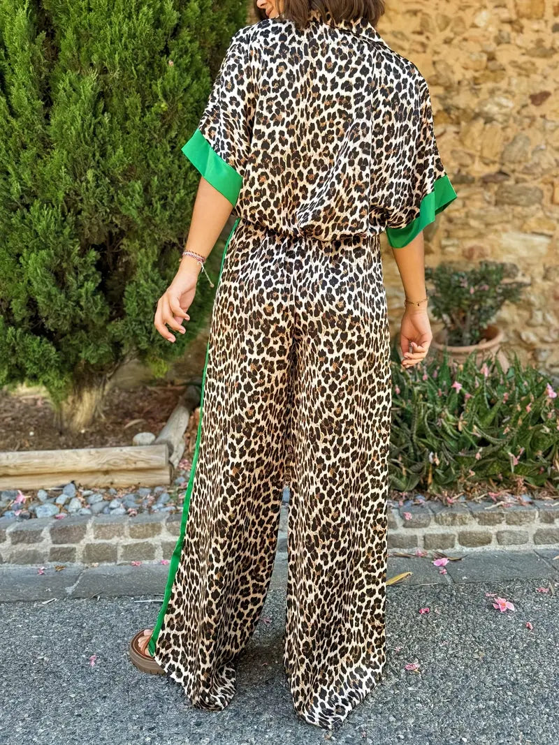 Comfortable women's leopard print V-neck jumpsuit, featuring stylish wide legs for elegant casual wear.