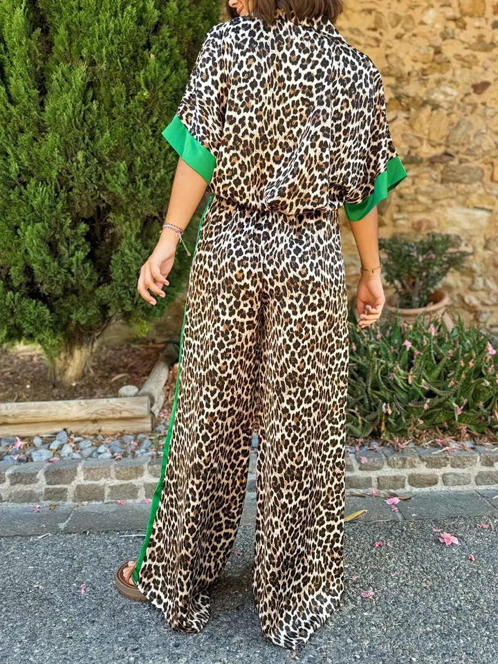 Comfortable women's leopard print V-neck jumpsuit, featuring stylish wide legs for elegant casual wear.