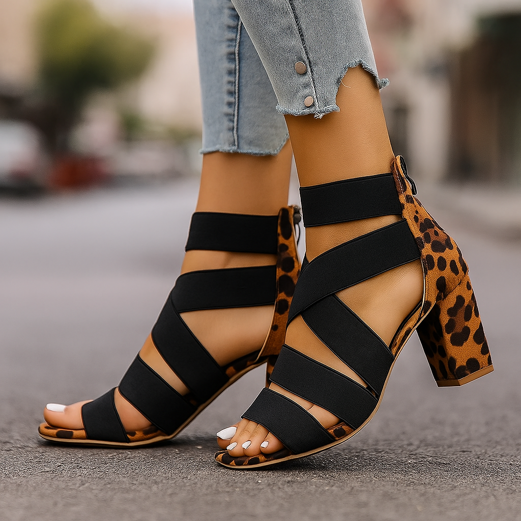 Women's chic leopard print wrap heels with a comfortable block heel, perfect for elegant evening wear & parties.