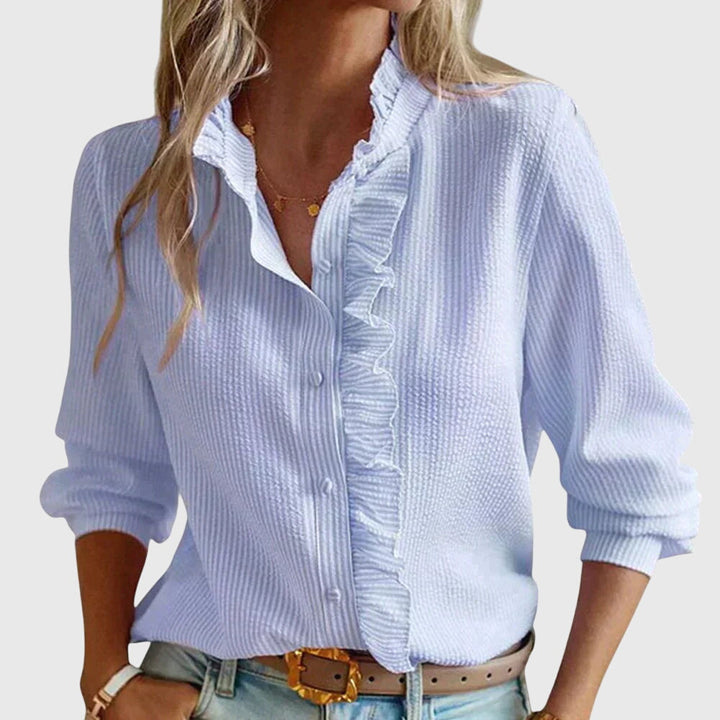 Women's chic long-sleeve blouse for versatile wear. Elegant fashion top, perfect for office or casual spring outfits.