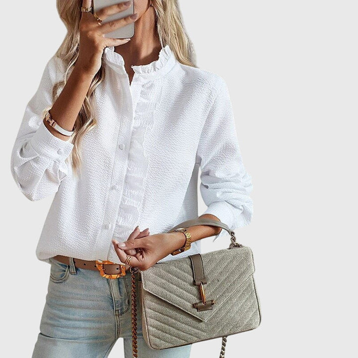 Chic women's long-sleeve blouse. Elegant, versatile top for office, casual, spring, and summer outfits. Comfortable fashion.