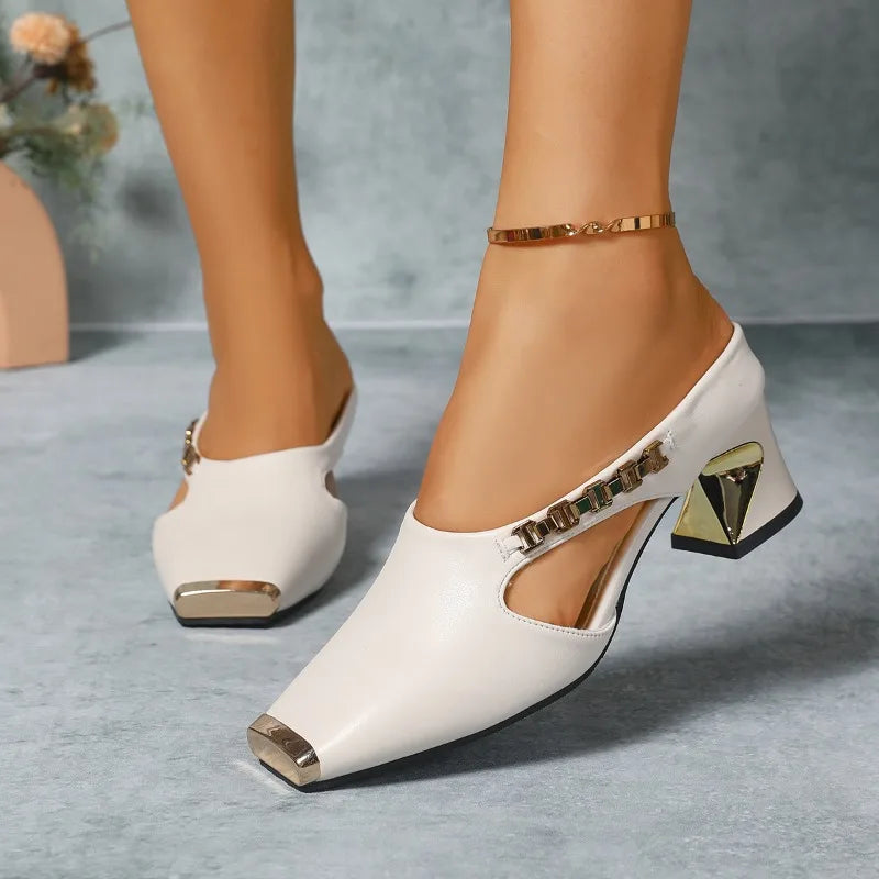 Fashionable women's metal toe heels. Elegant footwear with a chic gold accent, ideal for parties.