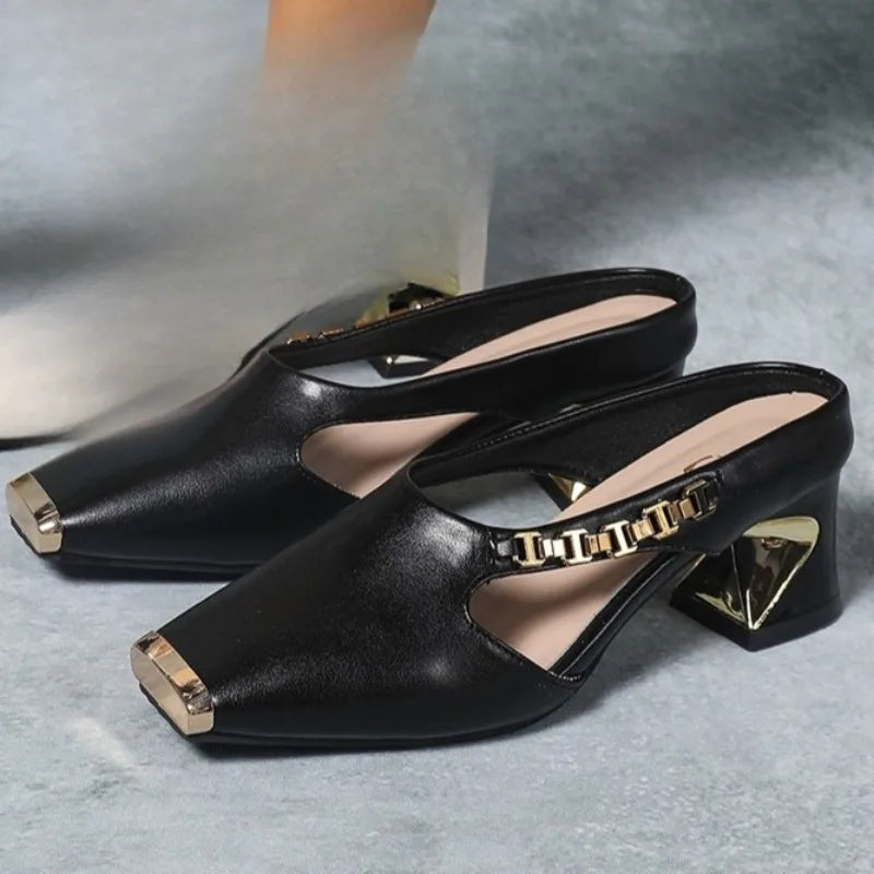 Stylish women's metal toe heels. High fashion statement shoes with a gold accent for elegant evenings.