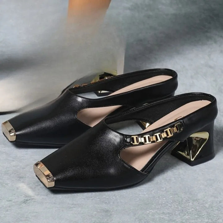 Stylish women's metal toe heels. High fashion statement shoes with a gold accent for elegant evenings.