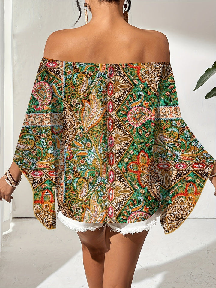 Modern off-shoulder blouse with vibrant geometric pattern, a feminine and trendy fashion top for women.