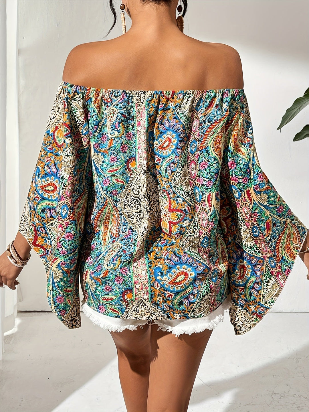 Versatile off-shoulder women's blouse, featuring a trendy geometric print for casual or elegant looks.