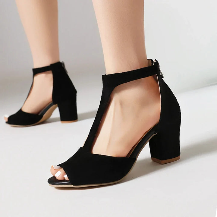 Chic women's open-toe block heels. Elegant T-strap footwear for comfort & stylish appeal.