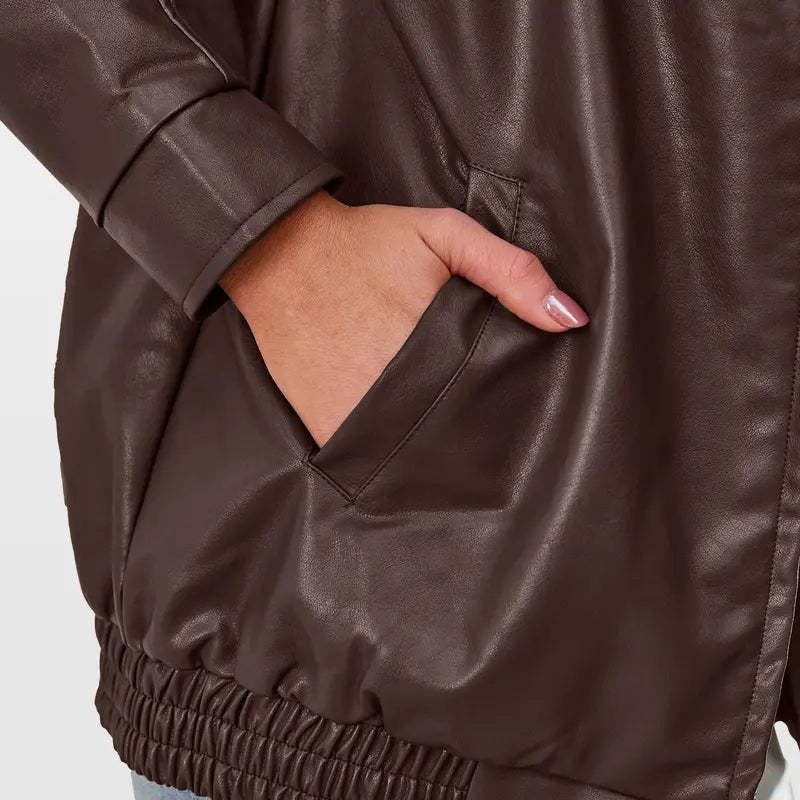 Black oversized zip jacket for women, a contemporary statement piece for everyday wear.