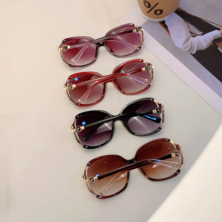 Women's chic oversized gradient sunglasses, elegant design with rose detail for a statement look.