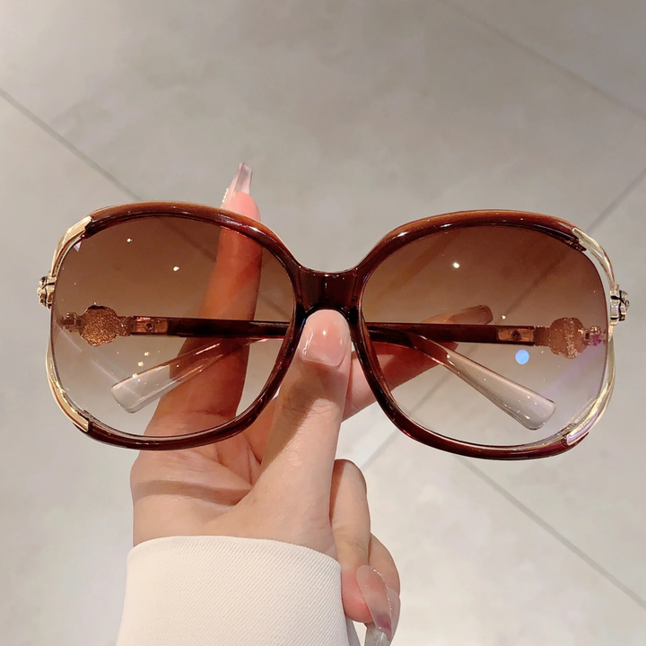 Stylish women's oversized sunglasses with gradient lenses for anti-glare and essential UV protection.