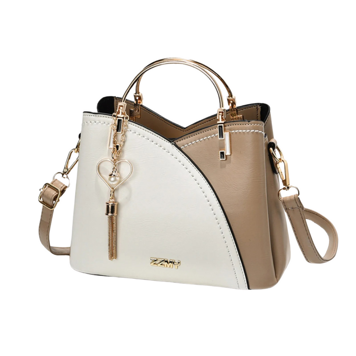 Women's chic patchwork tote bag with tassel charm, a stylish and versatile everyday shoulder bag.