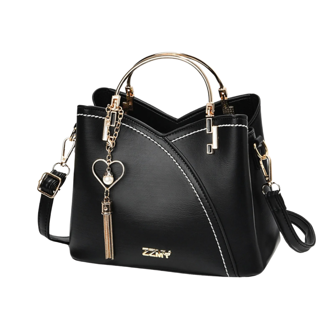 Fashionable women's patchwork tote bag featuring a decorative tassel charm, ideal as an everyday shoulder bag.
