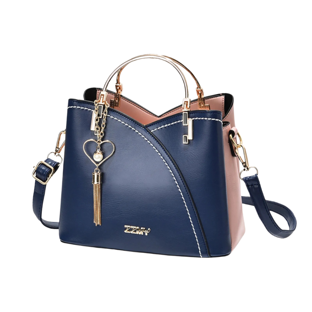 Elegant ladies' patchwork tote bag with a trendy tassel charm, a versatile and chic fashion accessory.