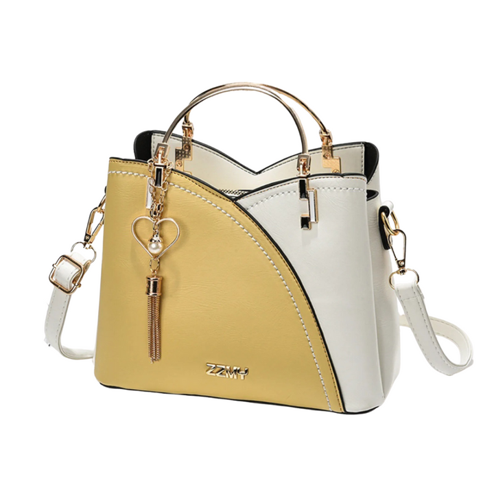 New women's patchwork tote bag, a trendy shoulder bag featuring a chic tassel charm for a stylish look.