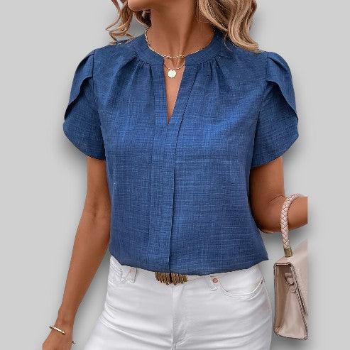 Women's chic petal sleeve blouse with pleated neckline. Elegant short sleeve top, perfect for office or casual wear.