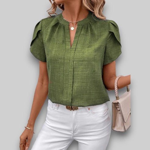 Versatile women's petal sleeve top. Stylish short sleeve blouse with delicate pleated neckline for any occasion.
