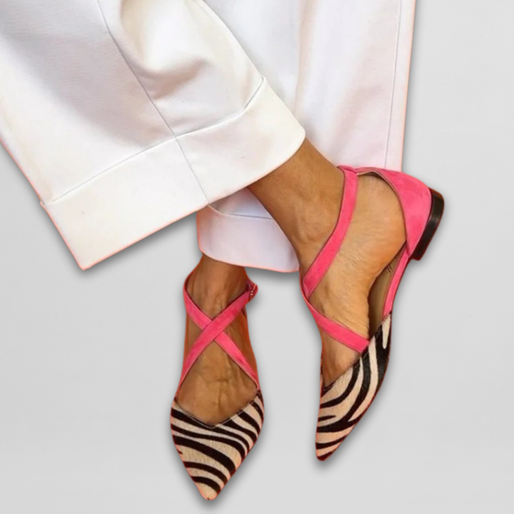 Women's chic pointed-toe ballet flats with comfortable zebra print straps. Perfect for everyday wear.