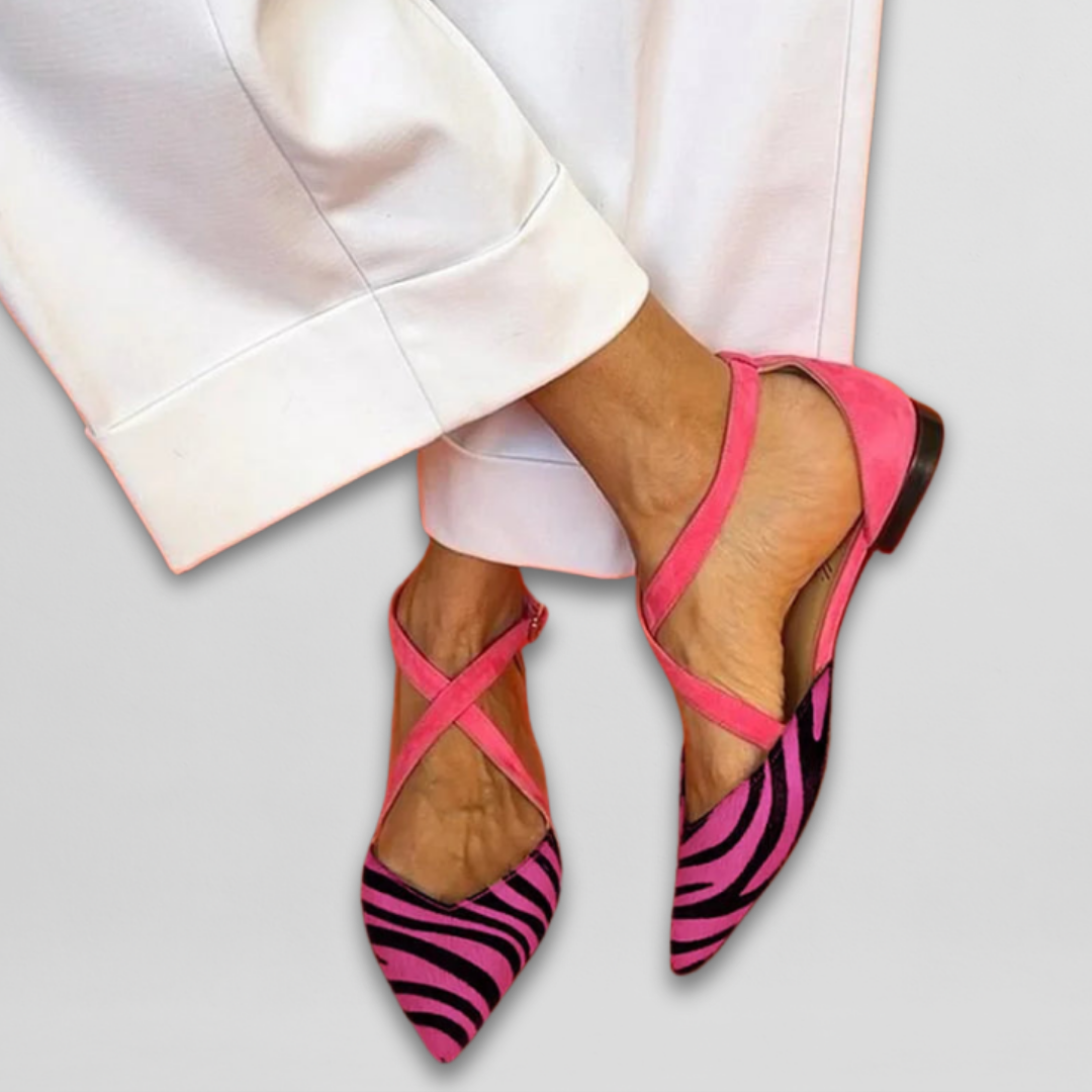 Women's fashionable zebra strap ballet flats. Comfortable pointed-toe shoes for chic everyday style.