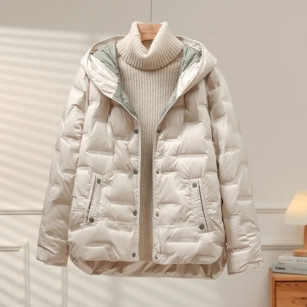 Women's chic quilted puffer jacket for winter, offering warmth & style. Ideal for casual outerwear.