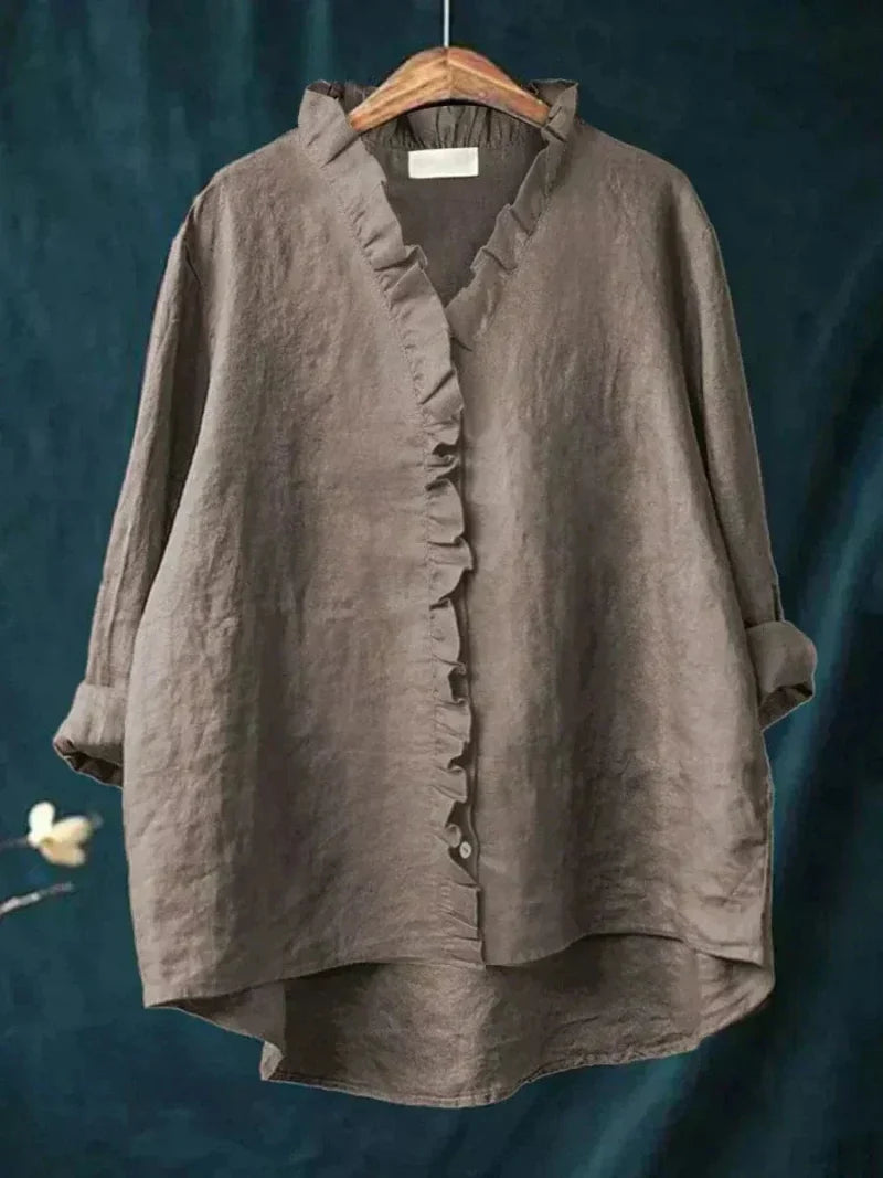 Relaxed fit women's ruffle blouse with long sleeves, offering comfort & chic style for modern women.