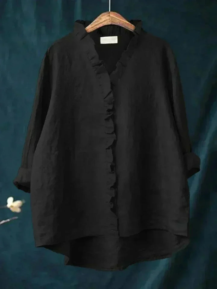 Stylish women's ruffle top with long sleeves, perfect for a chic and elegant look with everyday versatility.