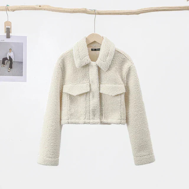 Warm women's casual short jacket, designed for winter comfort. Elegant fall fashion outerwear with a convenient zip.