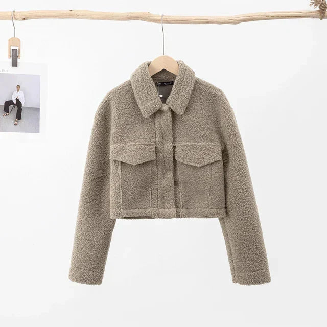 Chic women's short winter jacket, versatile outerwear. Warm and cozy for autumn fashion, suitable for everyday wear.