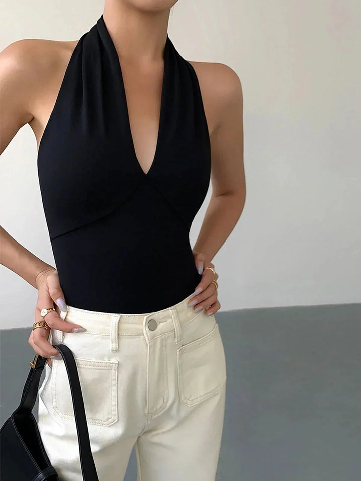 Women's chic sleeveless halter top with crossover V-neck, slim fit, perfect for summer daily style.