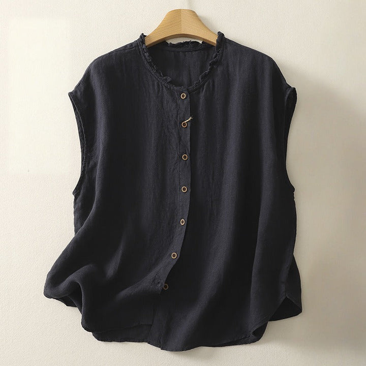 Cream sleeveless blouse with a stylish stand collar, offering a clean, chic, and versatile women's look.
